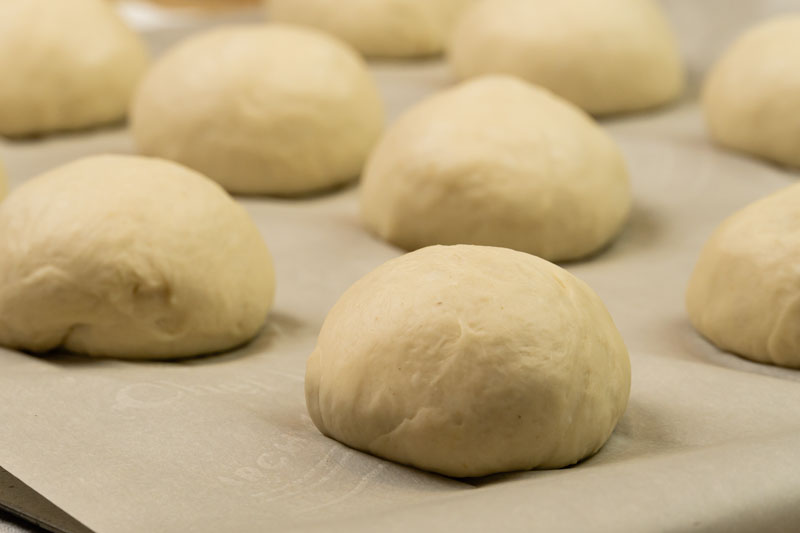 Pretzel buns prepared for baking
