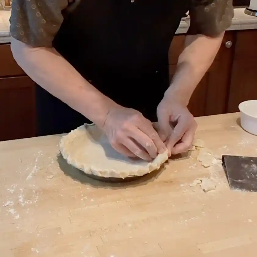 Cheeseburger Guru forming the edge of a pie crust.
