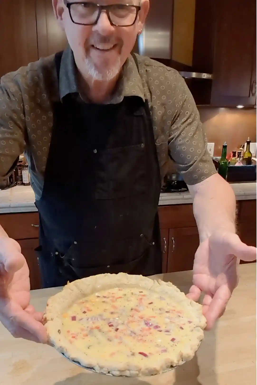 Cheeseburger Guru showing a bacon cheeseburger quiche that is ready to put into the oven.