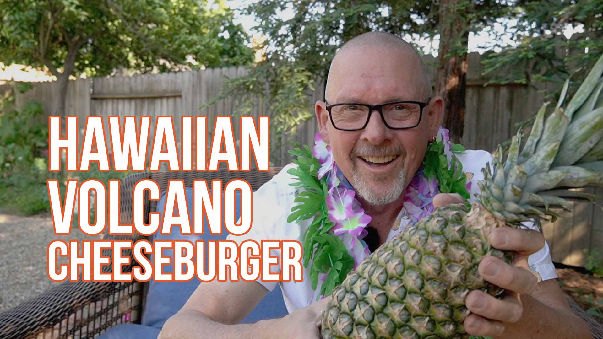 Promotional image of a person holding a pineapple along with text Hawaiian Volcano Cheeseburger